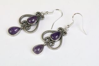 A pair of 925 sterling silver ladies drop earrings, art nouveau in style and each set with two