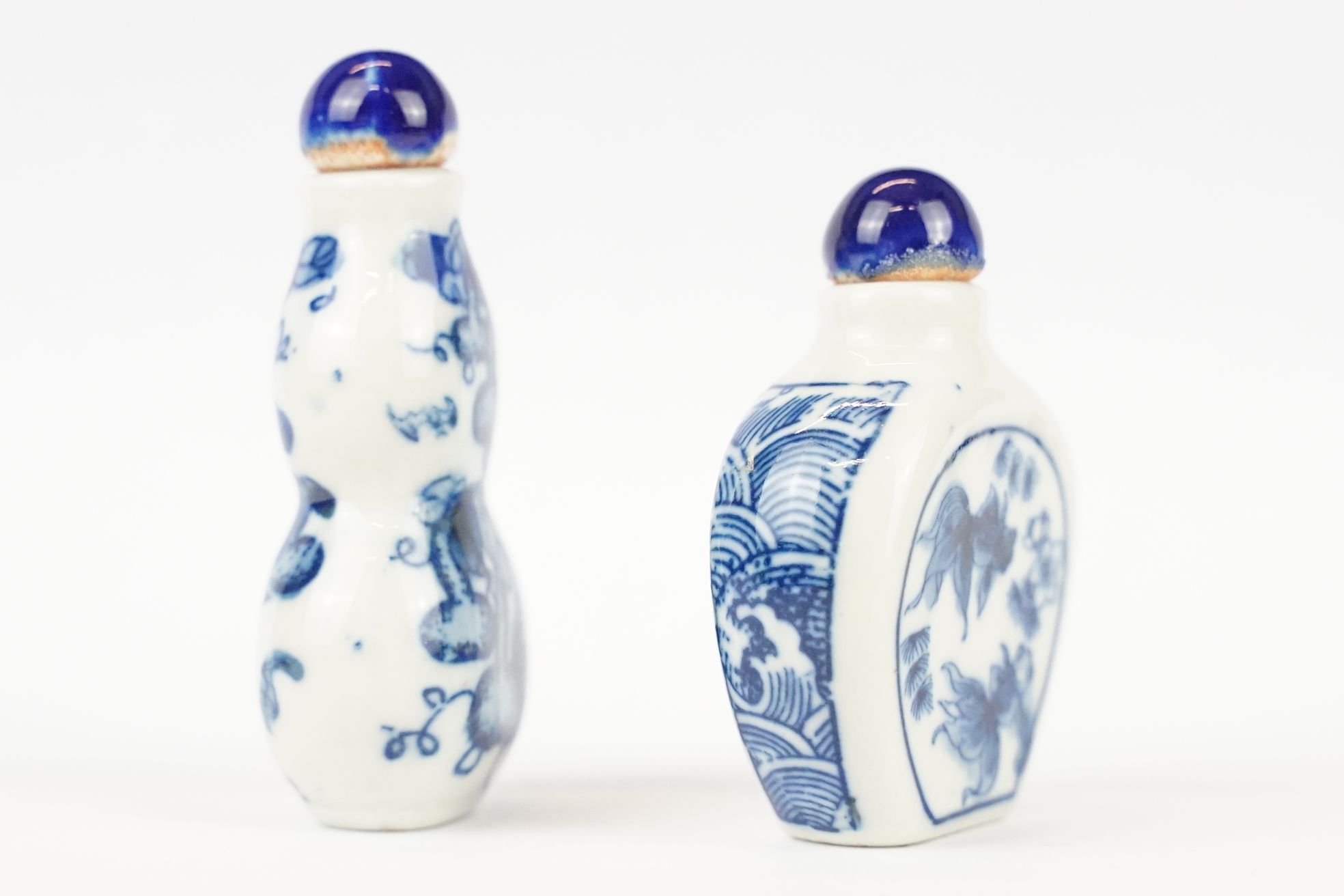 Two Chinese blue and white ceramic snuff bottles with traditional Chinese decoration. - Image 4 of 8