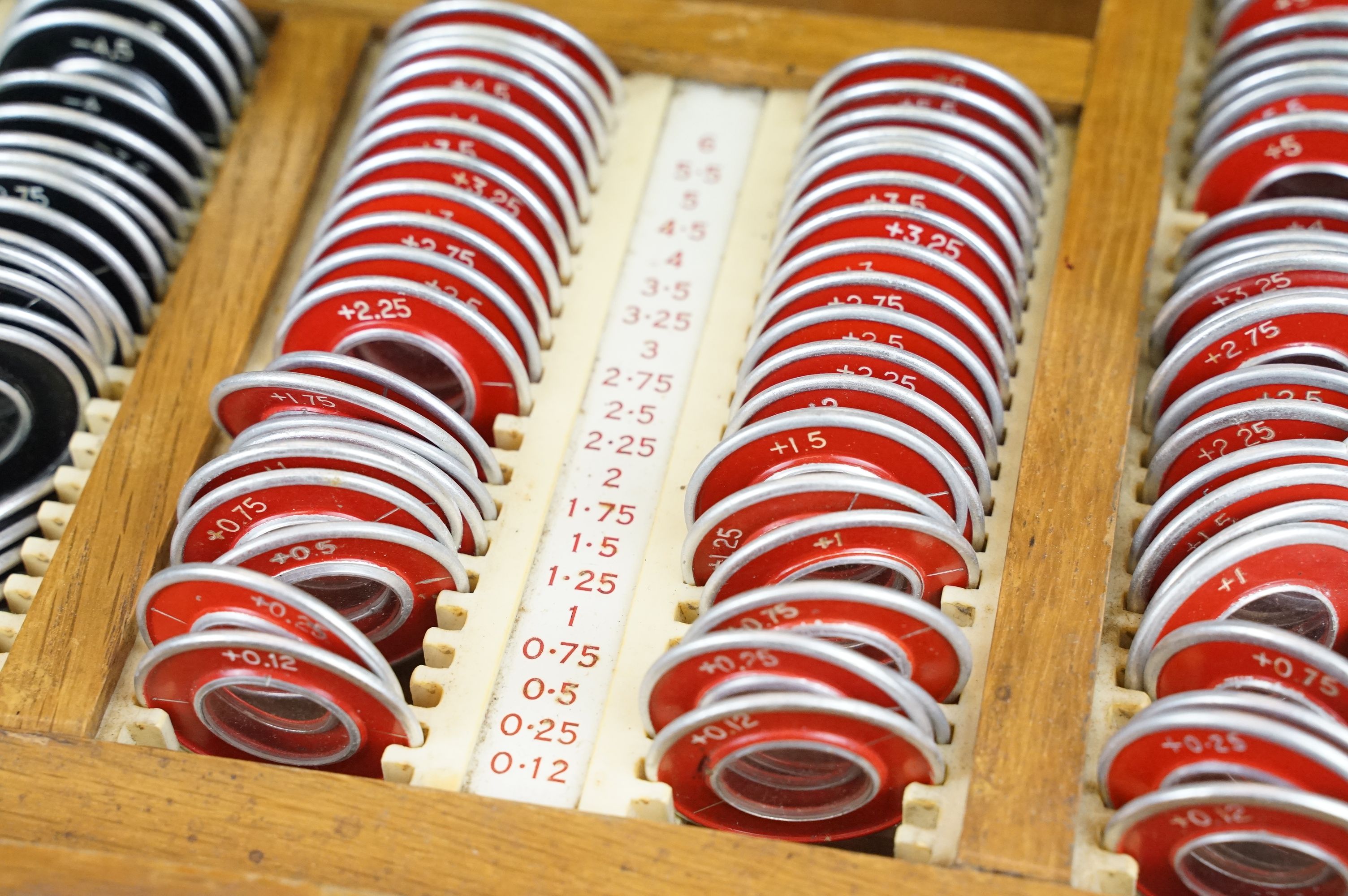 A vintage British made opticians eye testing set of lenses with spectacles. - Image 4 of 8