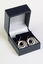 A pair of sterling silver modernist drop earrings.