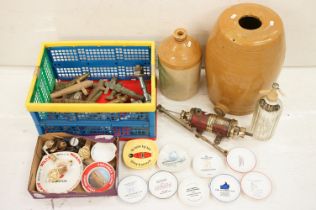 A group of mixed brewery collectables to include advertising ashtrays, bottle pourers, keg taps,