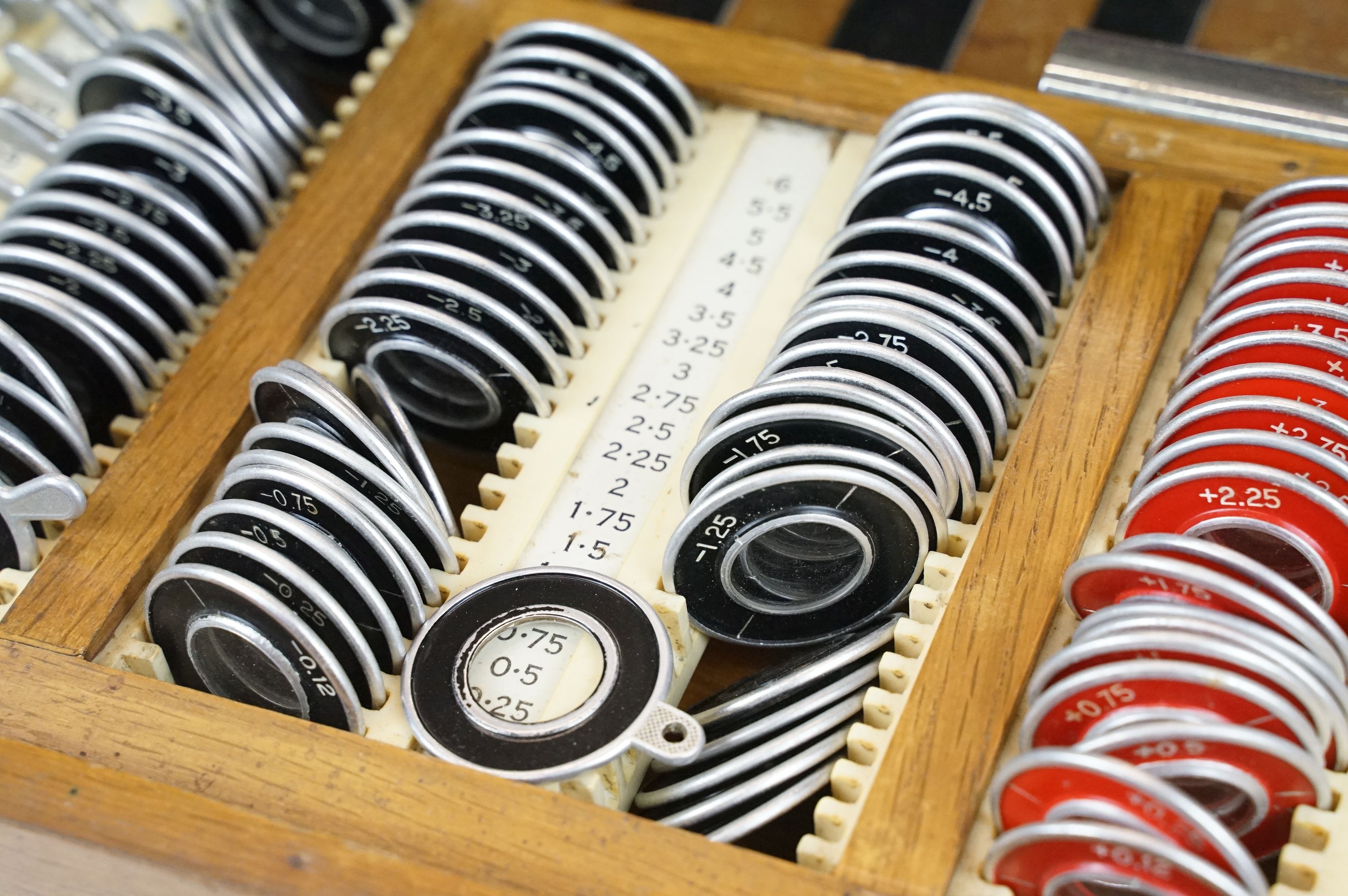 A vintage British made opticians eye testing set of lenses with spectacles. - Image 5 of 8