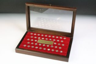 A cased silver miniature coin collection titled 'The Kings & Queens of England'