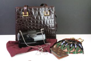 A Louis Vuitton leather card holder together with a Kurt Geiger black acrylic eventing bag with