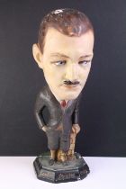 London Aristos Caps Art Deco chalkware shop display figurine in the form of a gentleman leaning on a