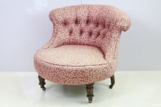 Edwardian low tub armchair, with button back, on turned fluted tapering legs and casters, 66cm