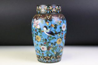 Chinese cloisonne enamel vase with polychrome floral decoration on a blue ground, approx 25cm high