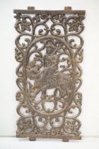 Antique Indian cast iron wall panel featuring a Goddess Durga riding a tiger within a pierced