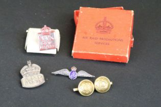 A small group of British World War Two era badges to include silver examples.
