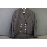 A British Royal Navy black jacket complete with brass buttons.