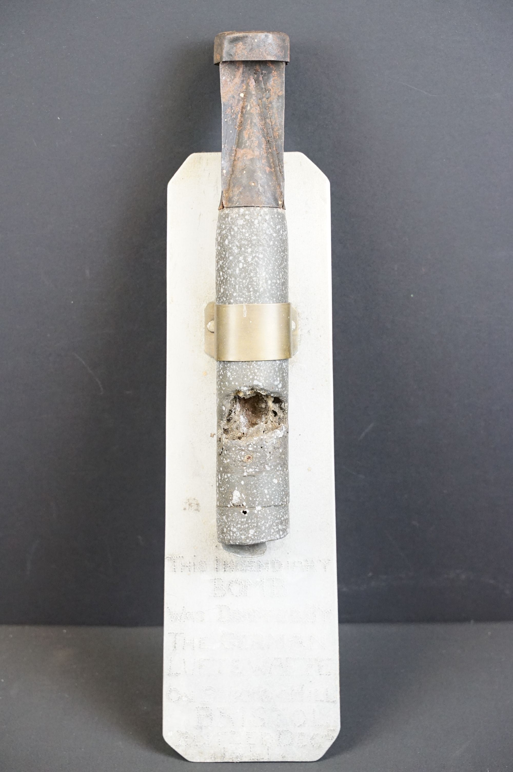 A World War Two German spent Incendiary bomb mounted to hand made aluminium plaque, purportedly