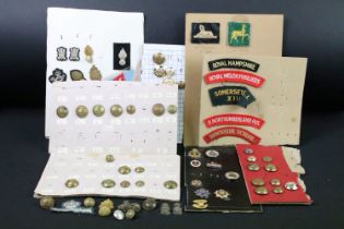 A collection of British Military Cloth badges, trade badges, shoulder titles, buttons and sweetheart
