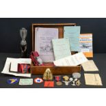 A box of mixed military collectables to include a World War One bomb fuse, spent mortar round, World