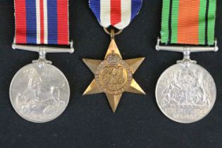 A British Full Size World War Two Medal Trio To Include The 1939-1945 British War Medal, The Defence