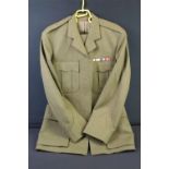 A British army dress uniform to include jacket and trousers.