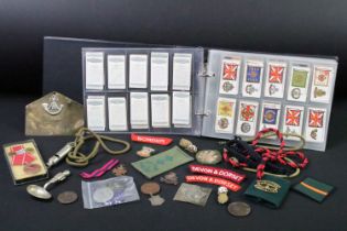 A collection of mixed military collectables to include cloth badges, shoulder titles, lanyards,