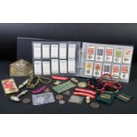 A collection of mixed military collectables to include cloth badges, shoulder titles, lanyards,