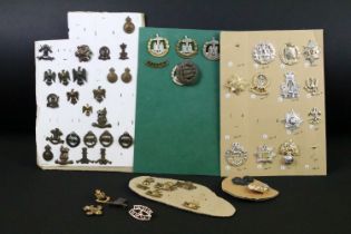 A collection of mainly British military Regimental cap and collar badges to include the 9th Lancers,