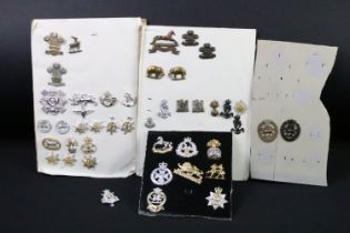 A collection of British military Regimental cap and collar badges to include The West Yorkshire