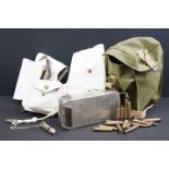 A box of mixed military collectables to include webbing belt with pistol holster, respirator bag and