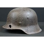 A World War One German stahlhelm steel helmet in relic condition.