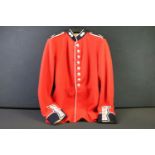 A British military Grenadier Guards tunic complete with Queens crown buttons and badges.