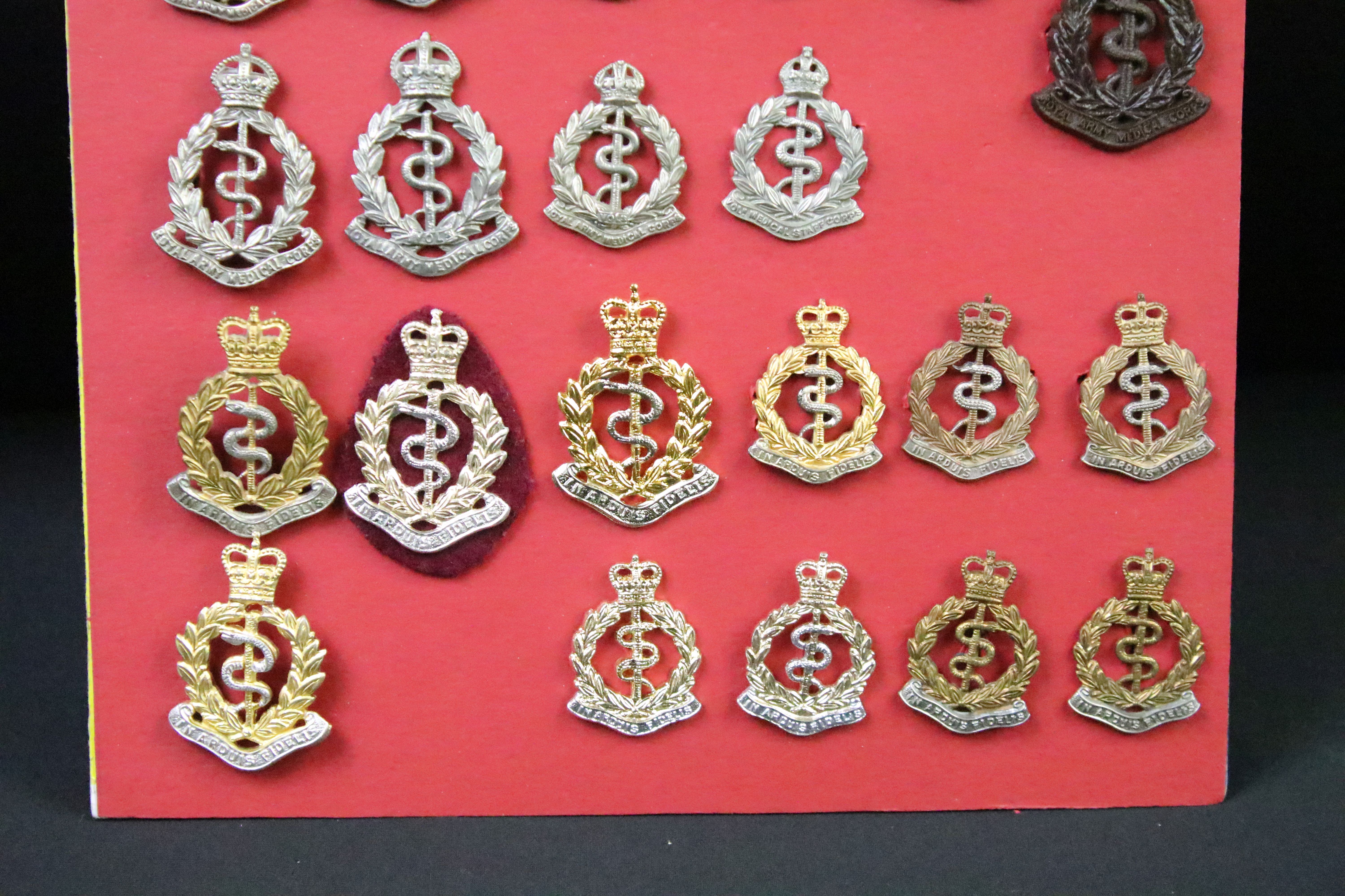 A collection of Kings and Queens crown British and Commonwealth Royal Army Medical Corps cap and - Image 9 of 9