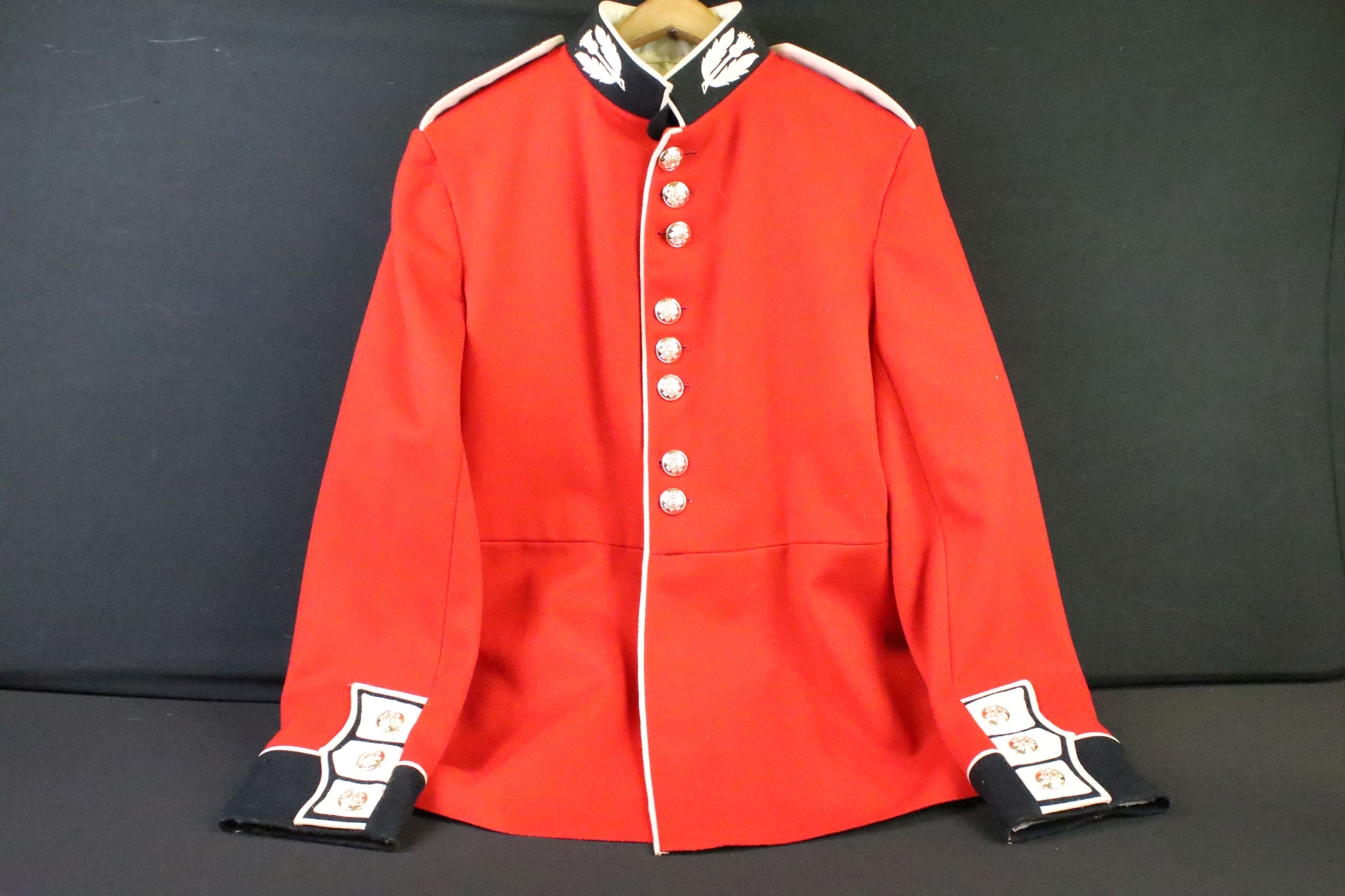 A British Military Scots Guards Regimental red tunic with embroidered collar and queens crown