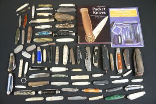 A good collection of pocket penknives and military jack knives together with associated reference