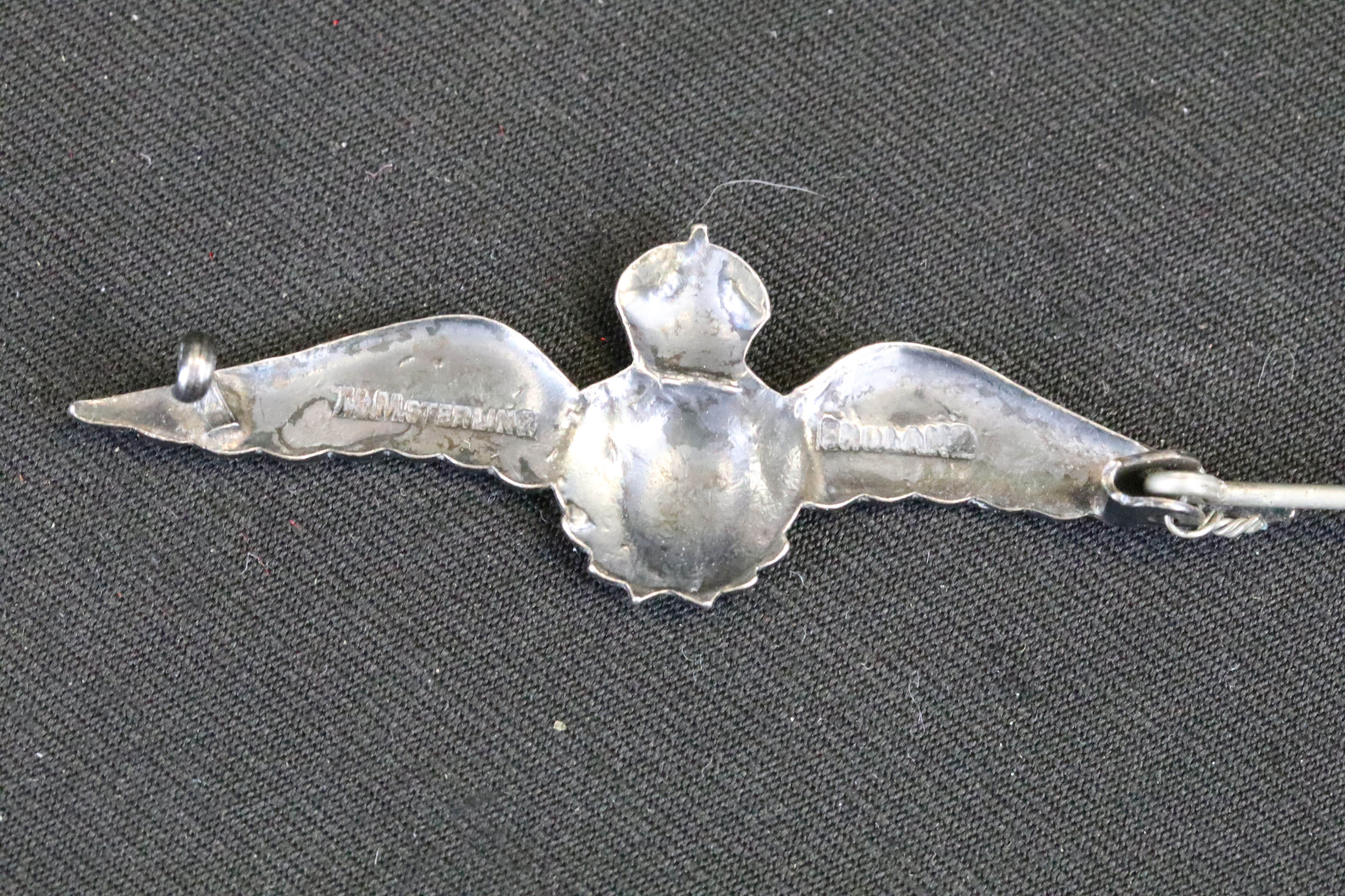 A small group of British World War Two era badges to include silver examples. - Image 7 of 9