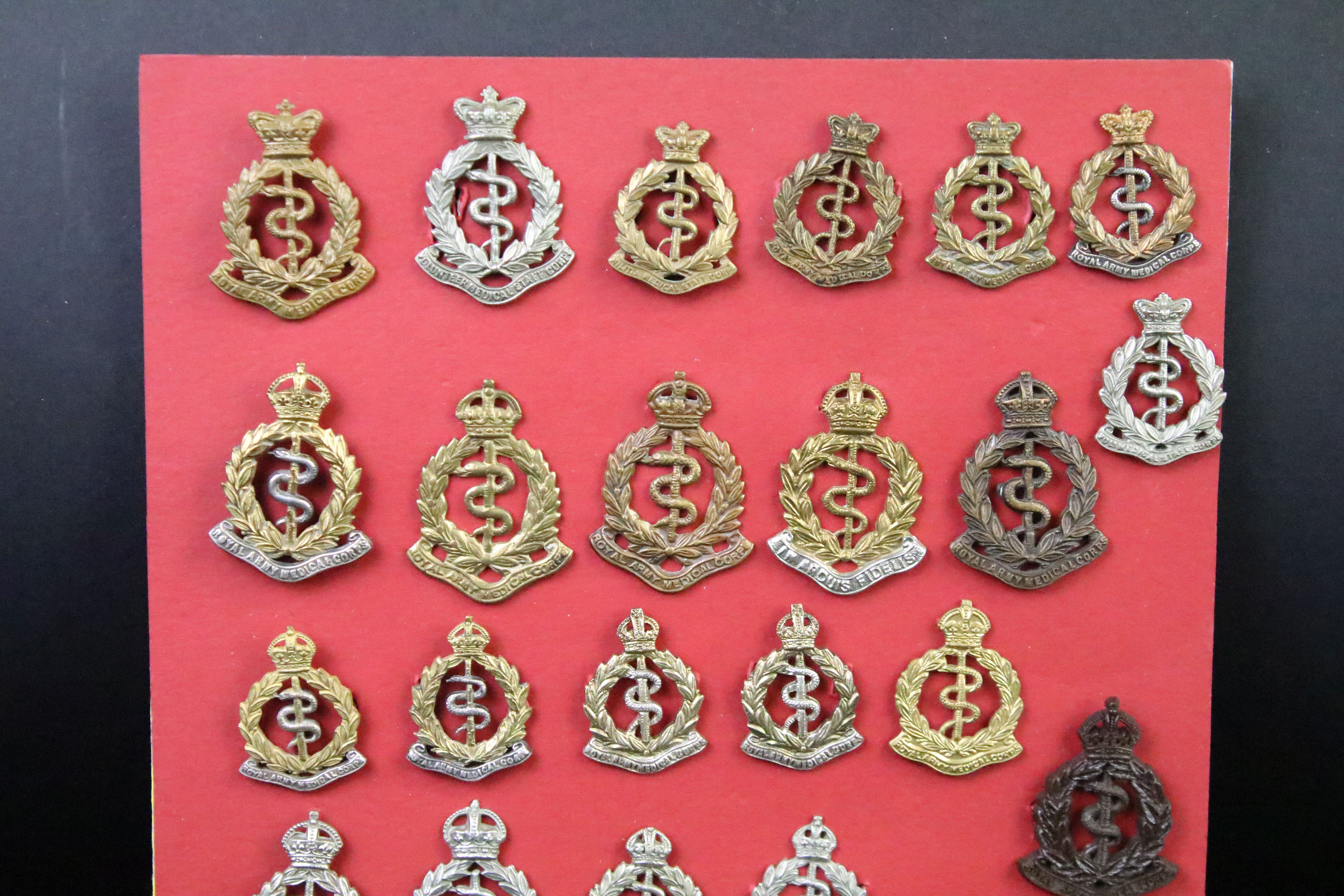 A collection of Kings and Queens crown British and Commonwealth Royal Army Medical Corps cap and - Image 7 of 9