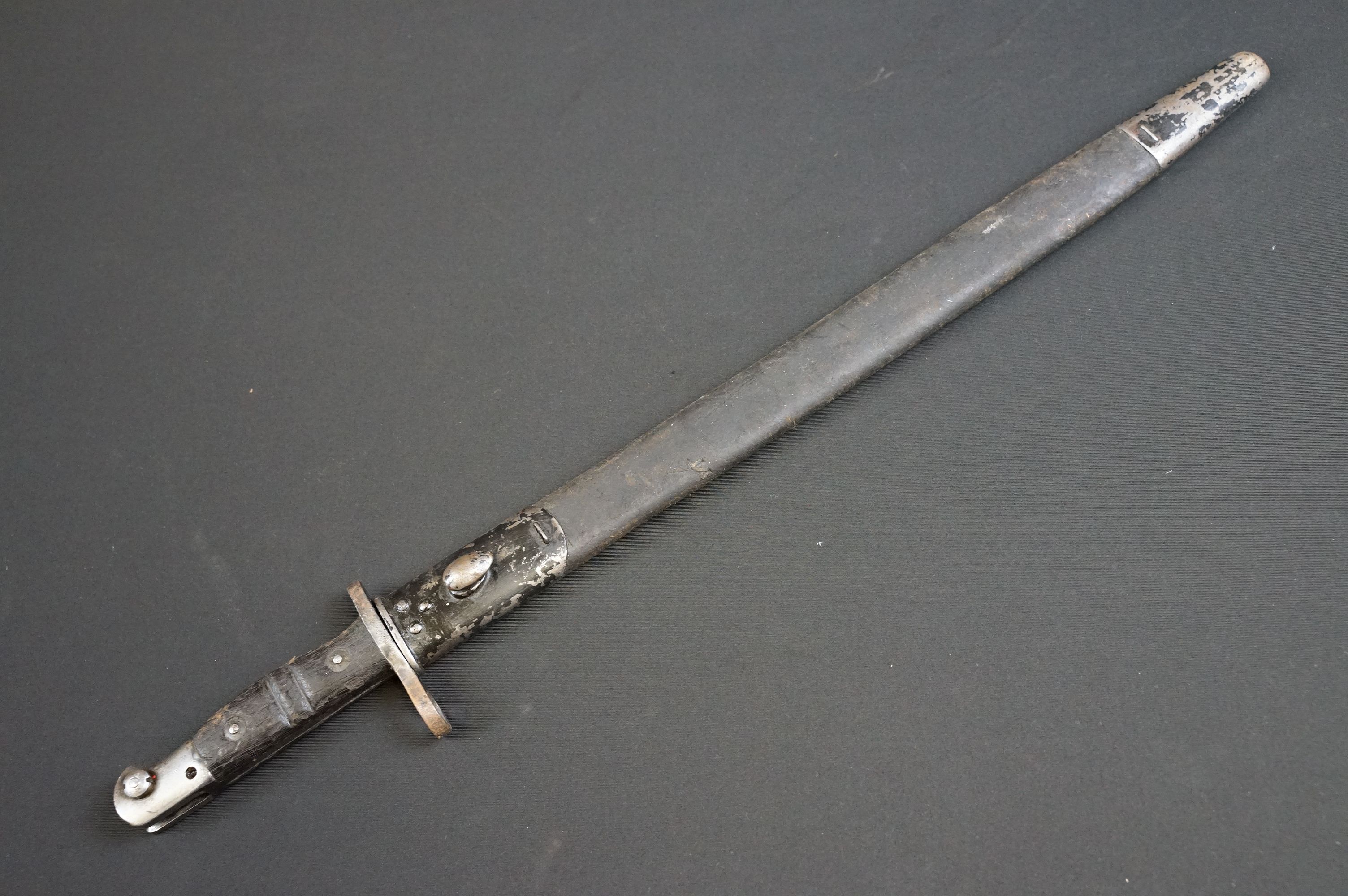 A United States World War One M1917 pattern bayonet complete with leather scabbard. - Image 16 of 16