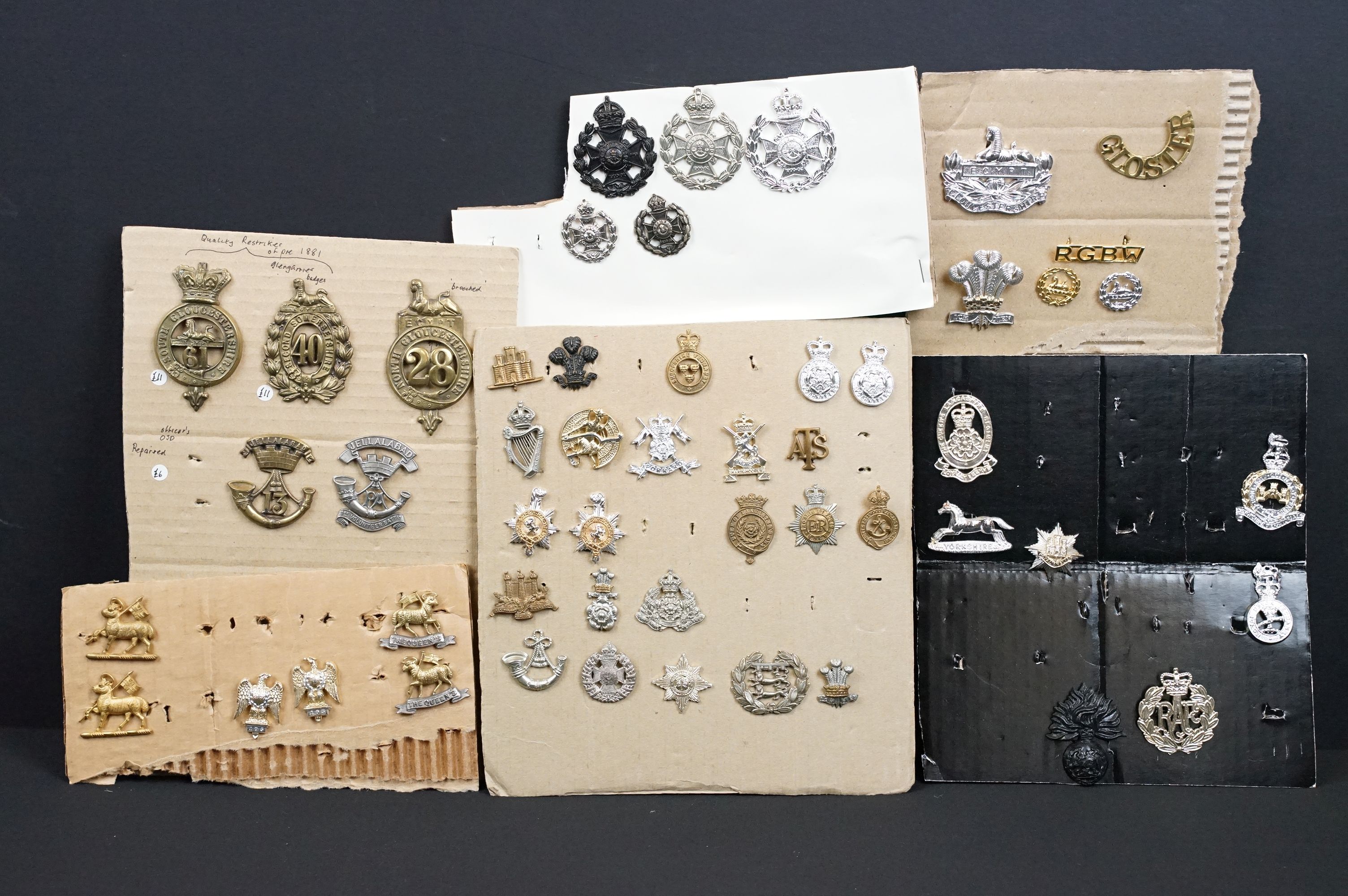 A collection of mainly British military cap and collar badges, mainly King Crown and including