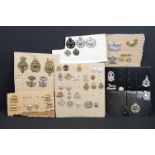 A collection of mainly British military cap and collar badges, mainly King Crown and including