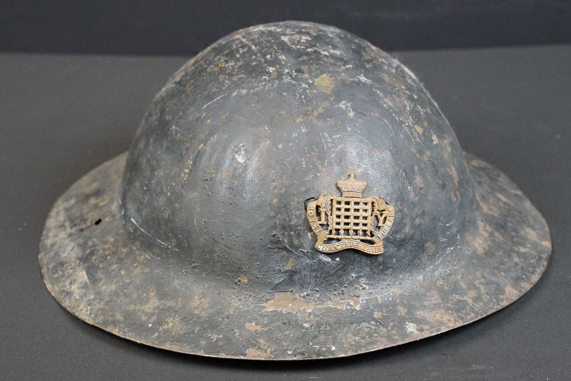 A British World War One Brodie helmet badged to the Royal Gloucestershire Fusiliers. - Image 2 of 6