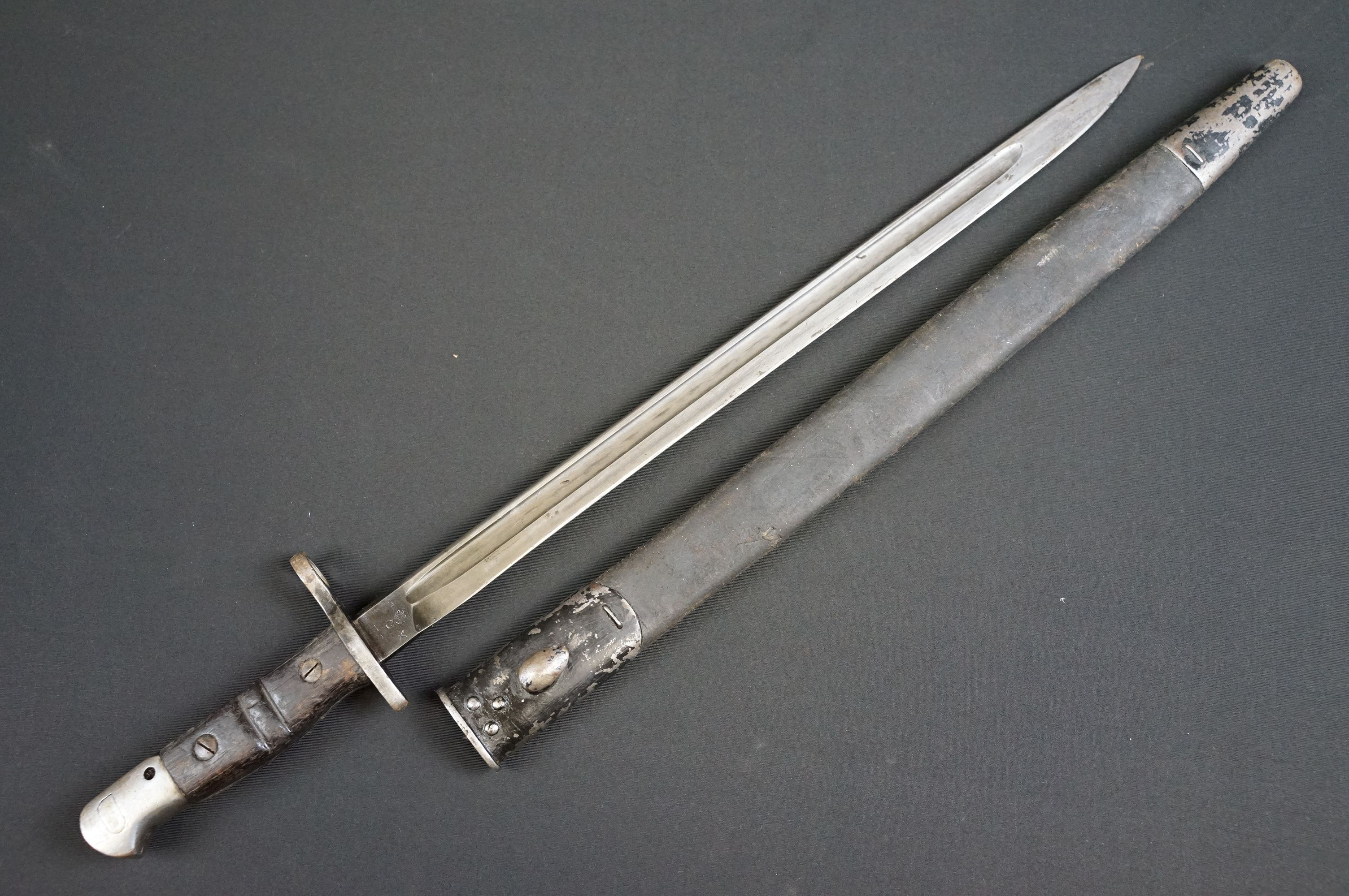 A United States World War One M1917 pattern bayonet complete with leather scabbard.