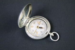 A British military issued World War One pocket marching compass, the case marked Dennison,