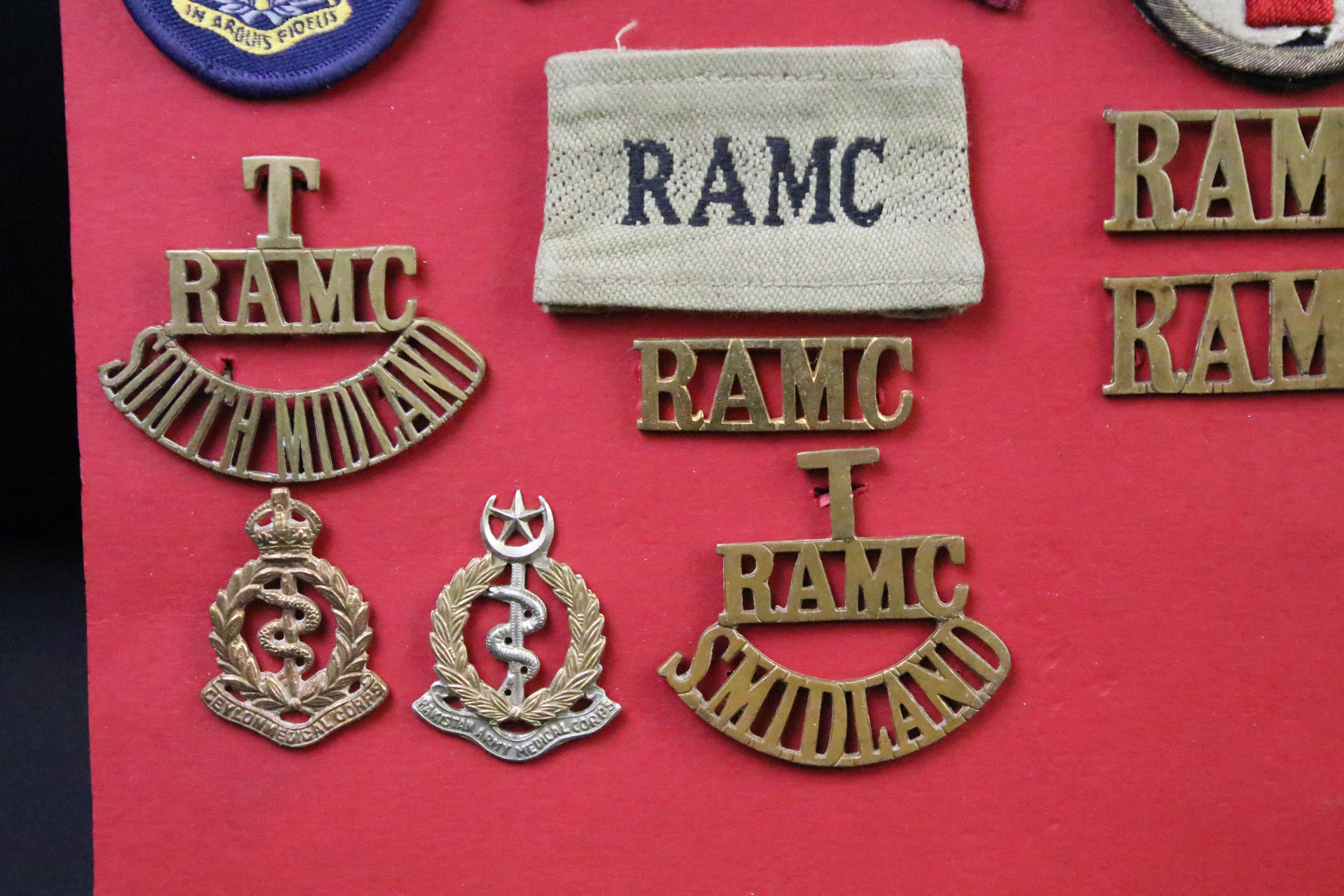 A collection of Kings and Queens crown British and Commonwealth Royal Army Medical Corps cap and - Image 5 of 9