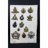 A collection of Canadian Military Queens crown cap badges to include The Canadian Officers