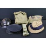 A small collection of mixed militaria to include a British Police Brodie helmet, pith helmet,