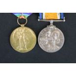 A full size British World War One medal pair to include the Victory medal and the British war medal,