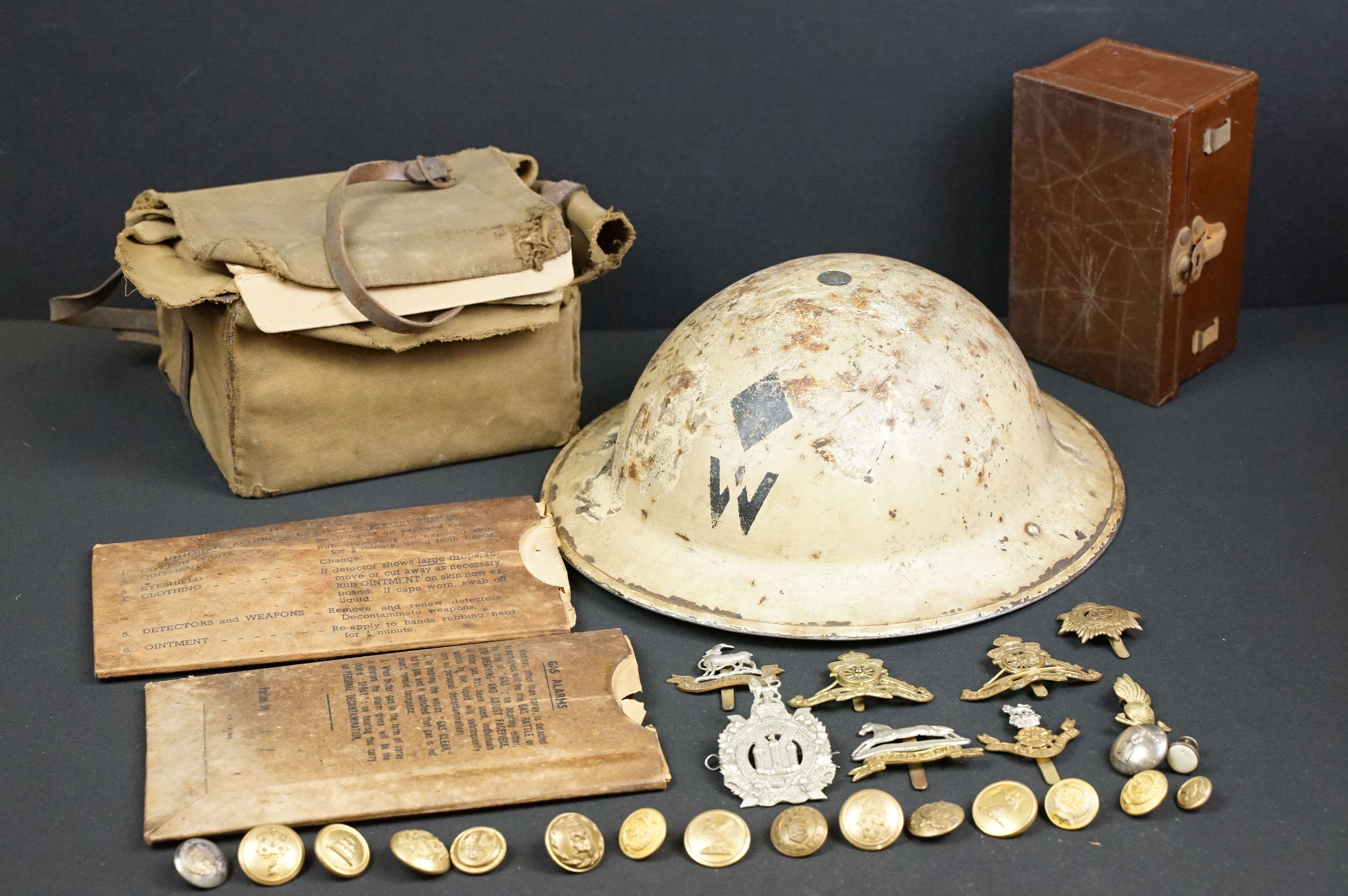 A small group of military collectables to include Wardens Brodie helmet, respirator and a