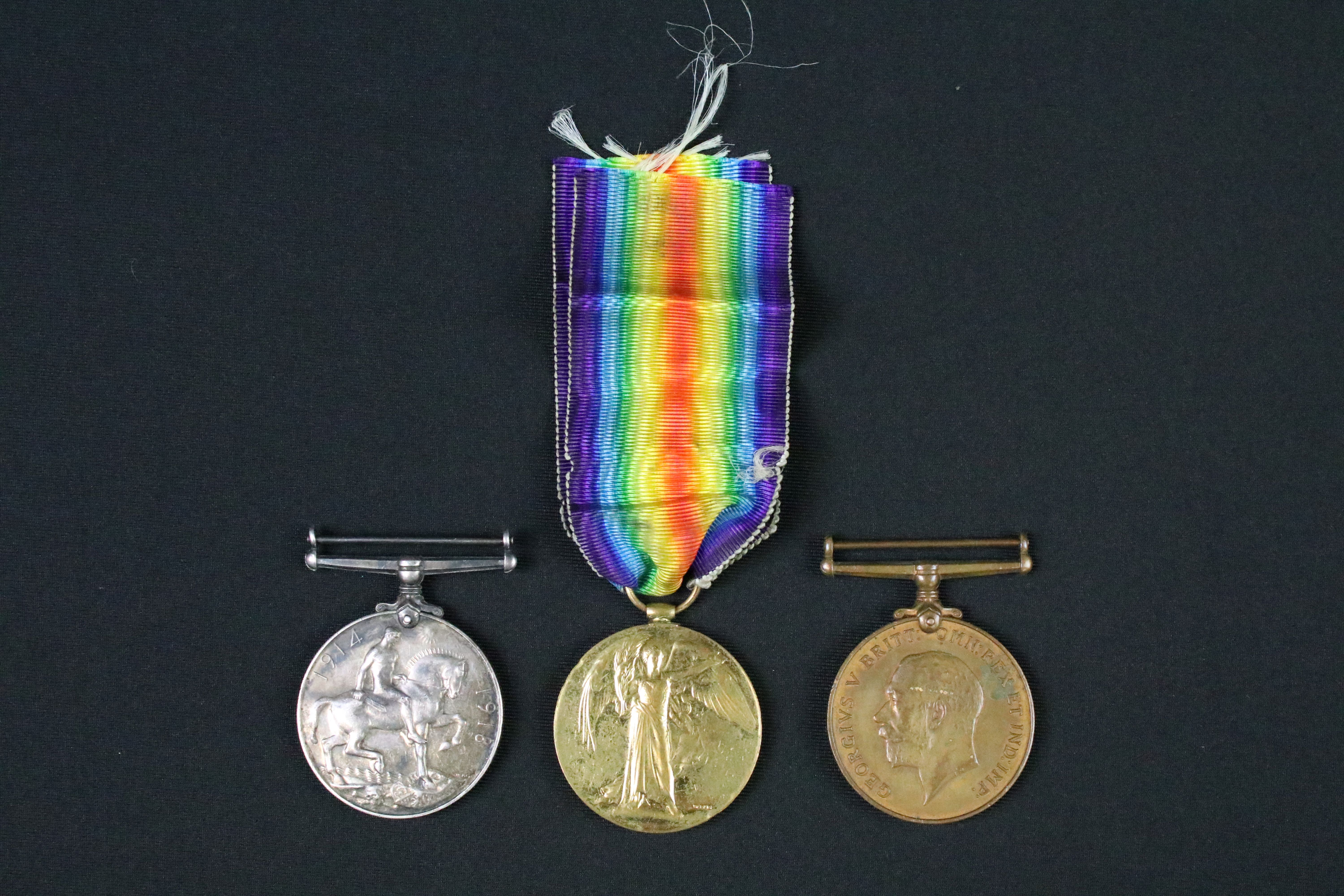 A British full size World War One medal group of three to include the Victory Medal, the 1914-1918