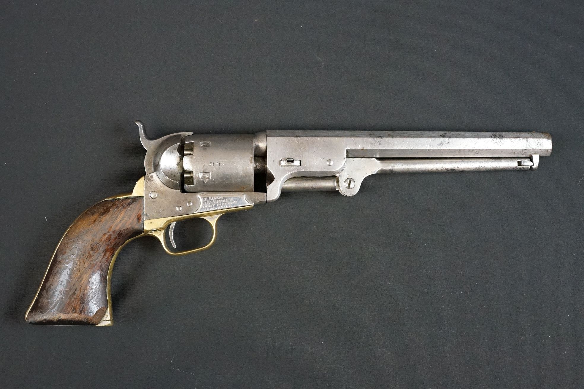 An antique Colt Navy revolver, 7-1/2″ octagonal barrel, case-hardened frame, loading lever, plunger,