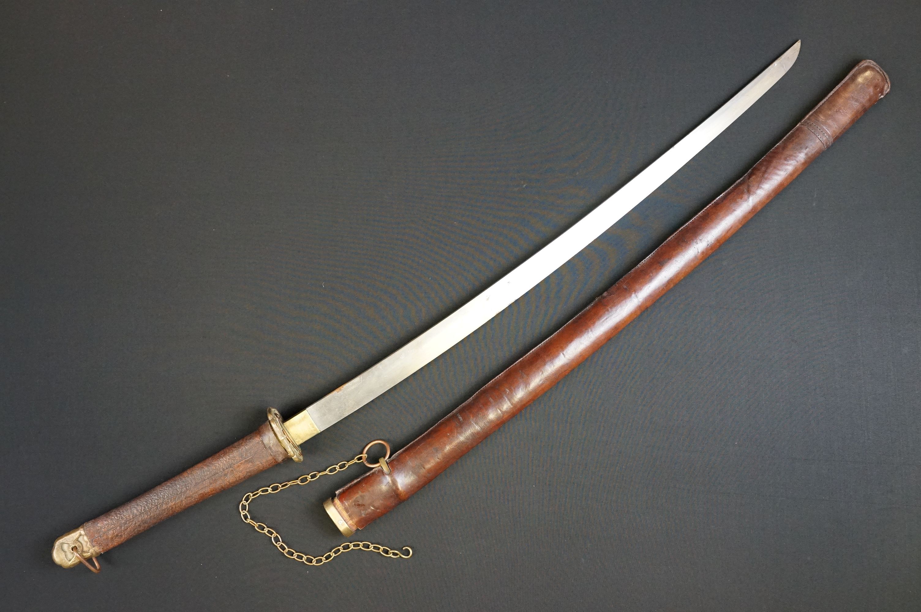 A World WarTwo JAPANESE SAMURAI KATANA SWORD, with leather covered handle and leather sheath