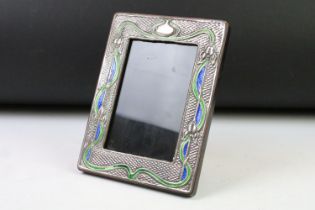 A Liberty style silver and enamel art nouveau picture frame, approx 19.5cm x 14.5cm