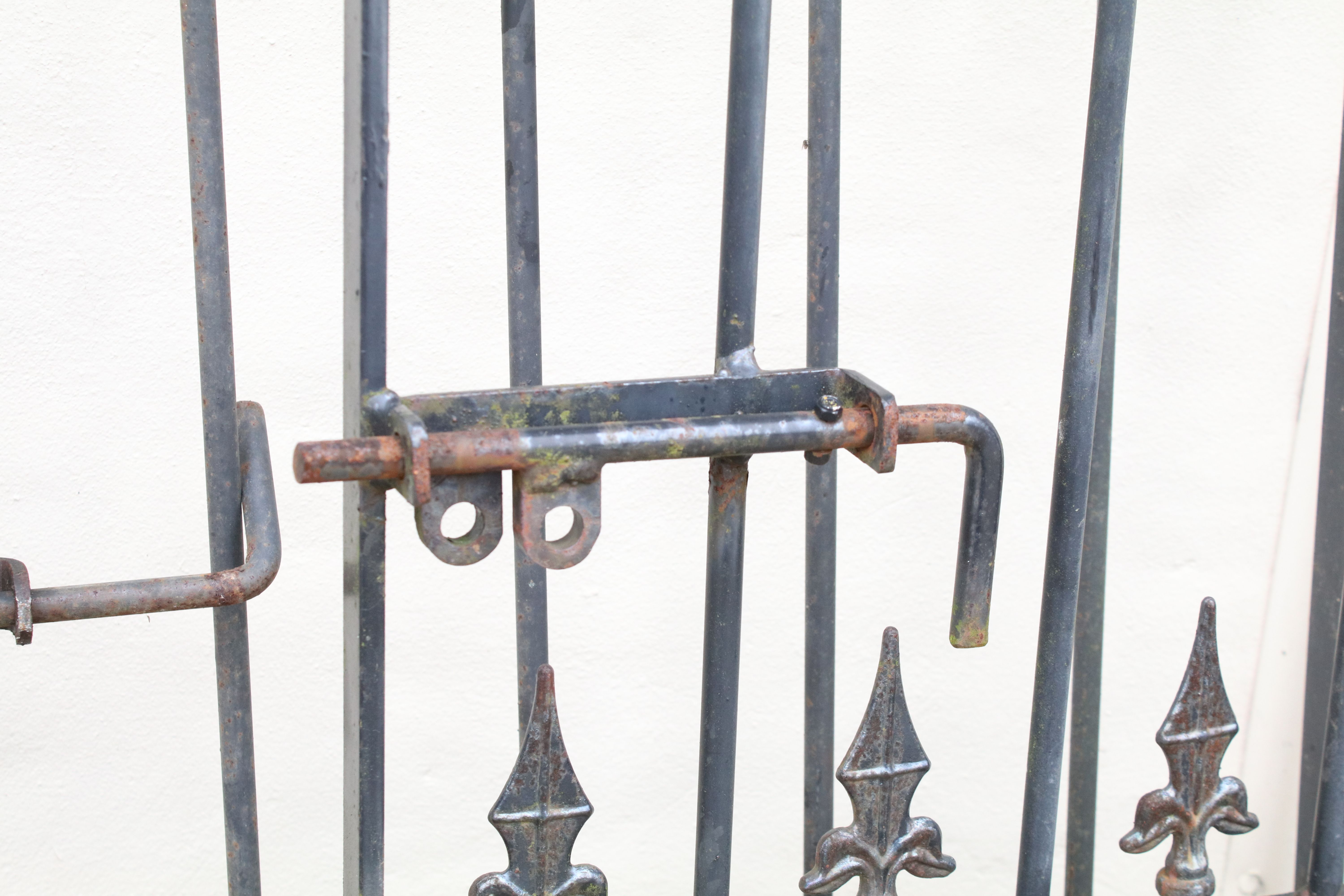 Two wrought iron metal gates, with two gate posts, the larger 170cm high x 115cm wide (including - Image 2 of 6