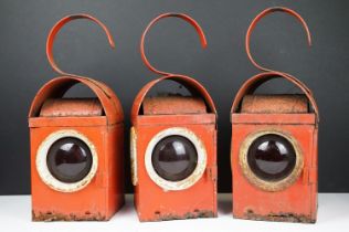 Three Chalwyn roadside or railway lamps, each 38cm high