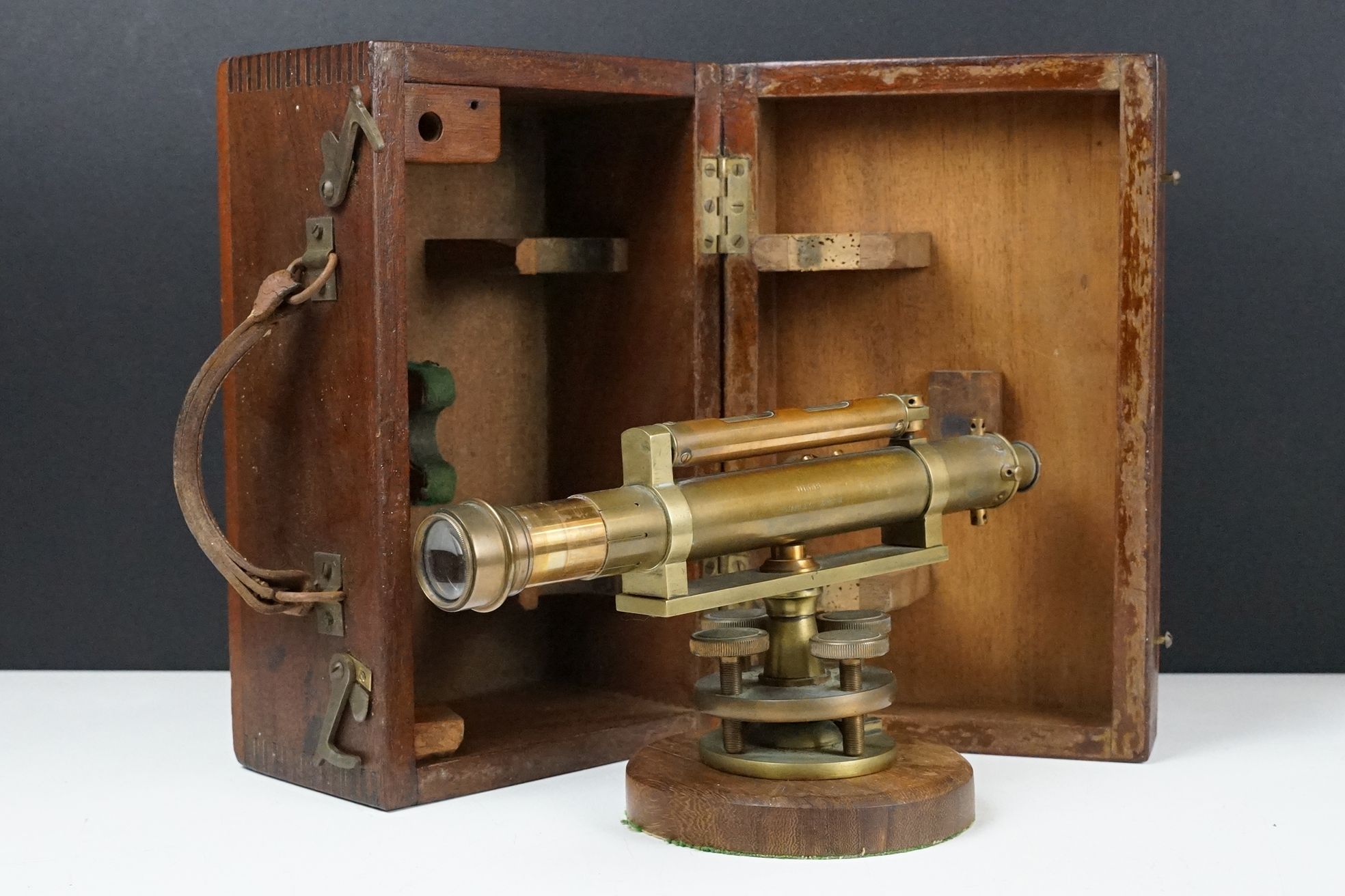 Stanley brass theodolite, barrel marked ' 111338 Stanley, London ' with circular wooden stand and