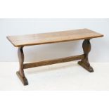 Oak coffee table of stretchered form, 41cm high x 91cm wide x 32cm deep